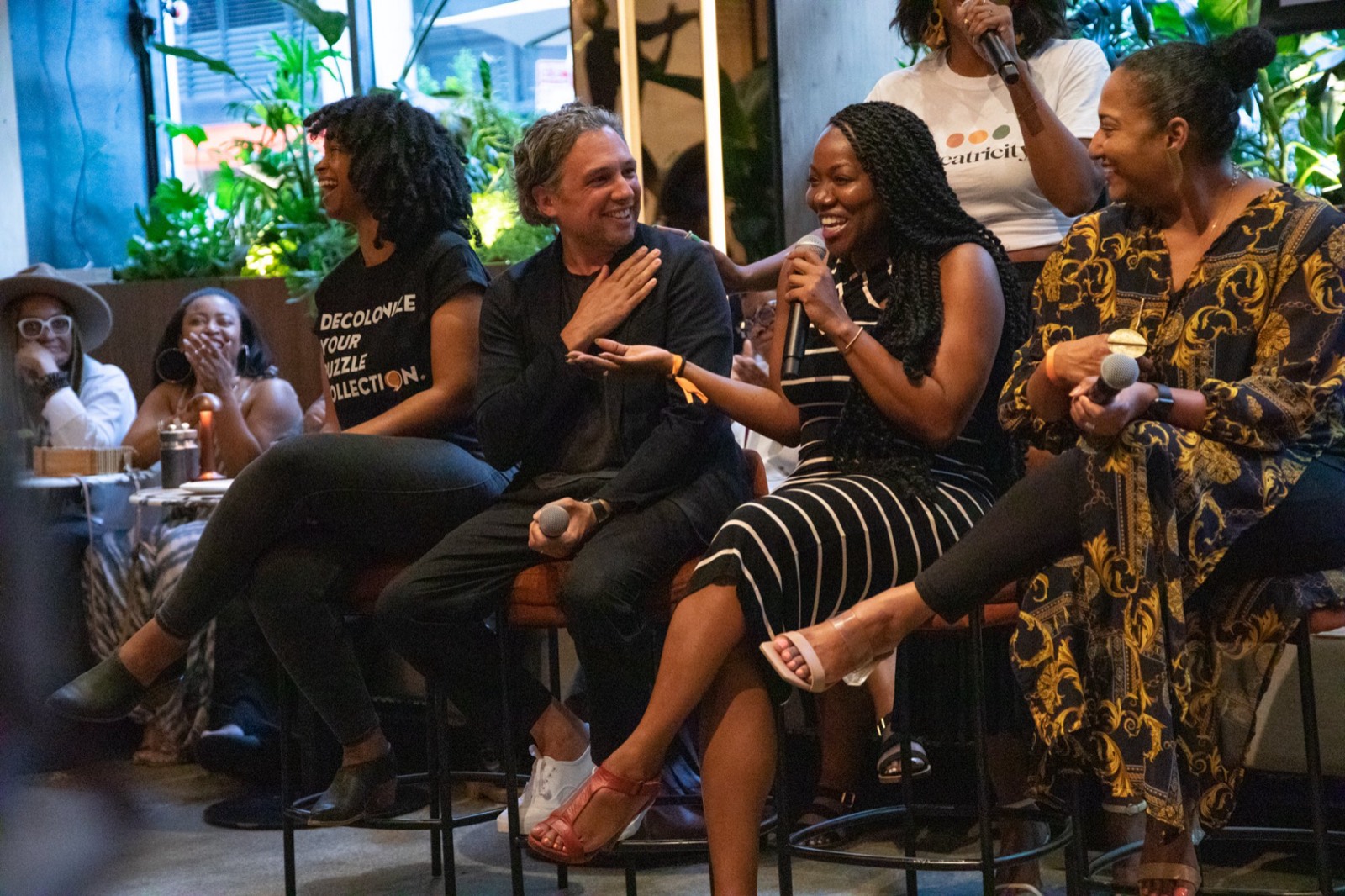 Panelists laughing together during a Creatricity conversation