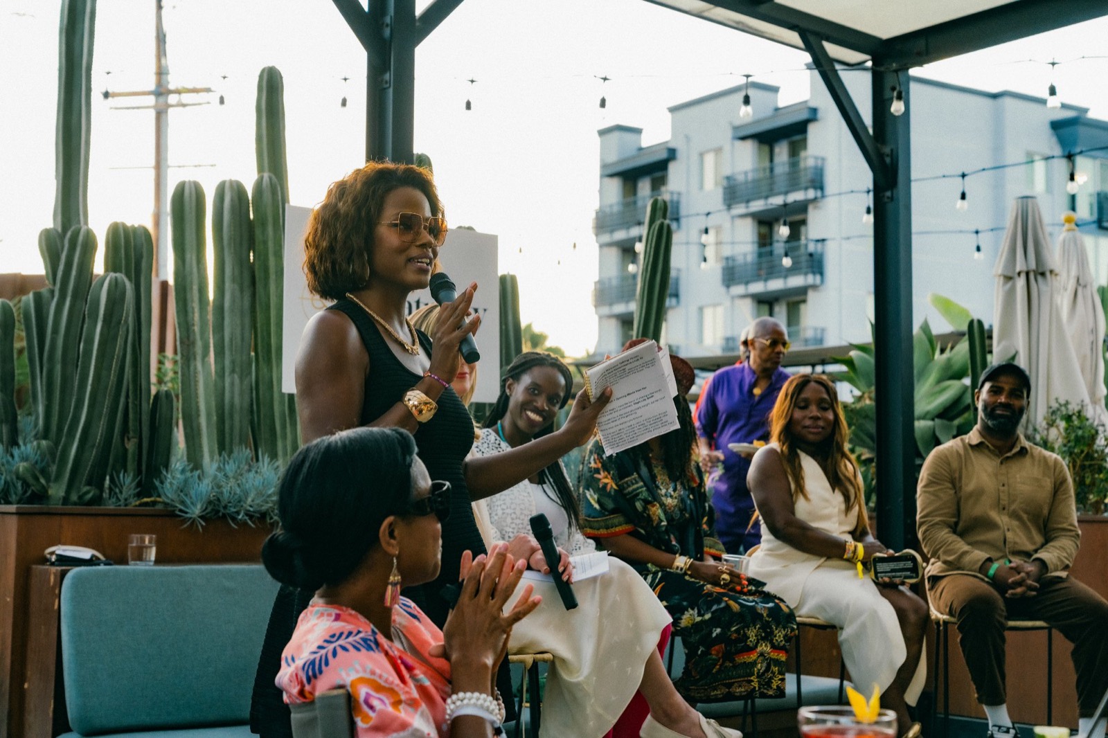 A speaker addressing the room at a Creatricity rooftop gathering